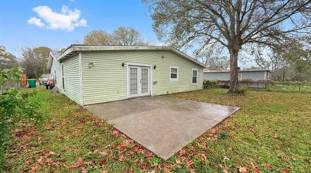 a view of a house with a yard and garage