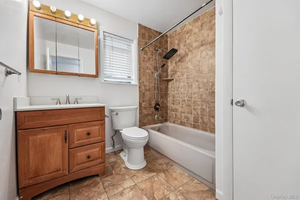 a view of an empty room and wooden floor