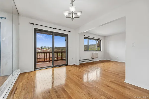 a view of an empty room with a bathroom
