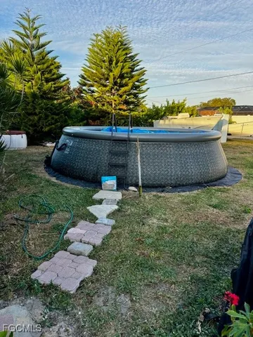 a view of a back yard of the house