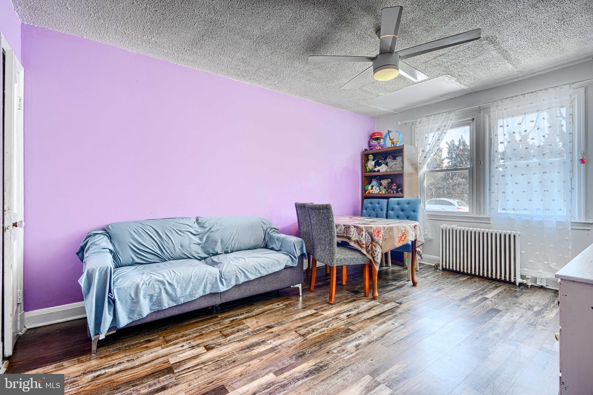 804 Quail Street Baltimore, MD 21224 - Photo 2 of 39 a living room with furniture and wooden floor