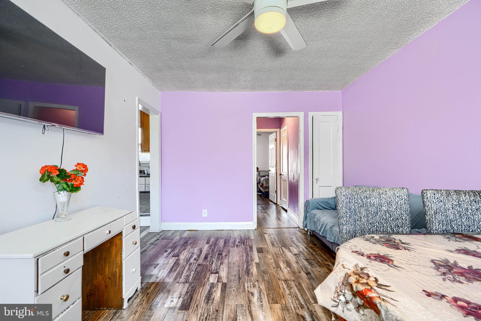 804 Quail Street Baltimore, MD 21224 - Photo 5 of 39 a bedroom with a bed and a dresser