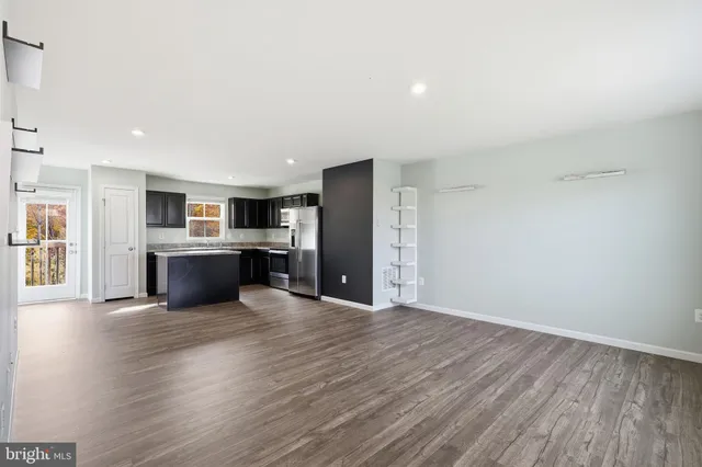 a view of kitchen with wooden floor