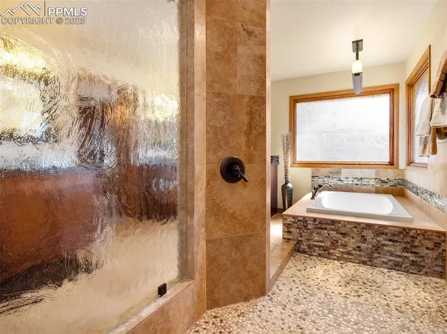 a bathroom with shower bathtub and sink