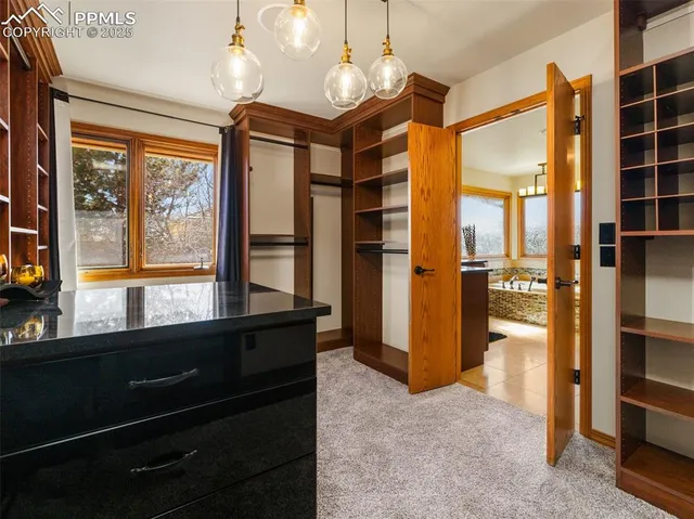a view of a bathroom with a shower and a sink