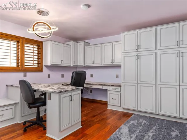 a open kitchen with cabinets appliances and a window