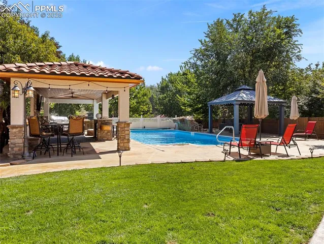 a view of an house with backyard porch and sitting area