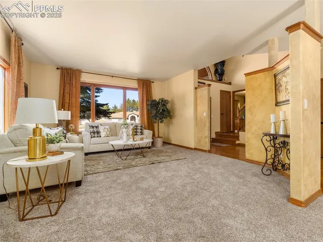 a living room with furniture and a table