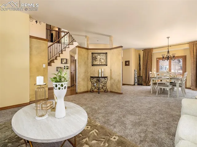 a view of a livingroom with furniture and a table
