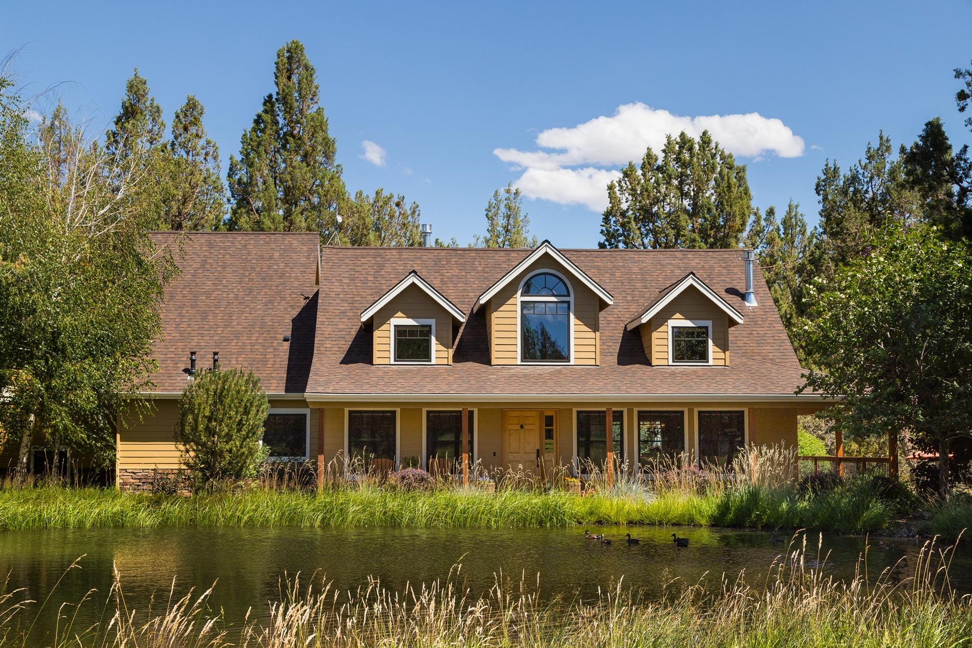 64980 Gerking Market Road Bend, OR 97703 - Photo 1 of 35 The Front of the home looks west over the large pond and park like setting. There are 36 ducks that like to call this pond home.