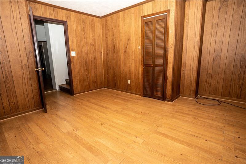 305 Wolfe Street Dublin, GA 31021 - Photo 18 of 27 a view of empty room with wooden floor
