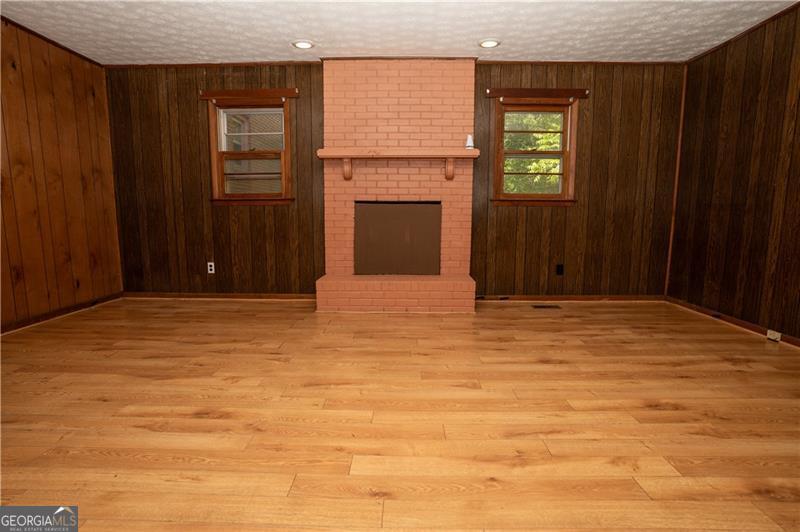 305 Wolfe Street Dublin, GA 31021 - Photo 23 of 27 a view of wooden floor and windows in a room