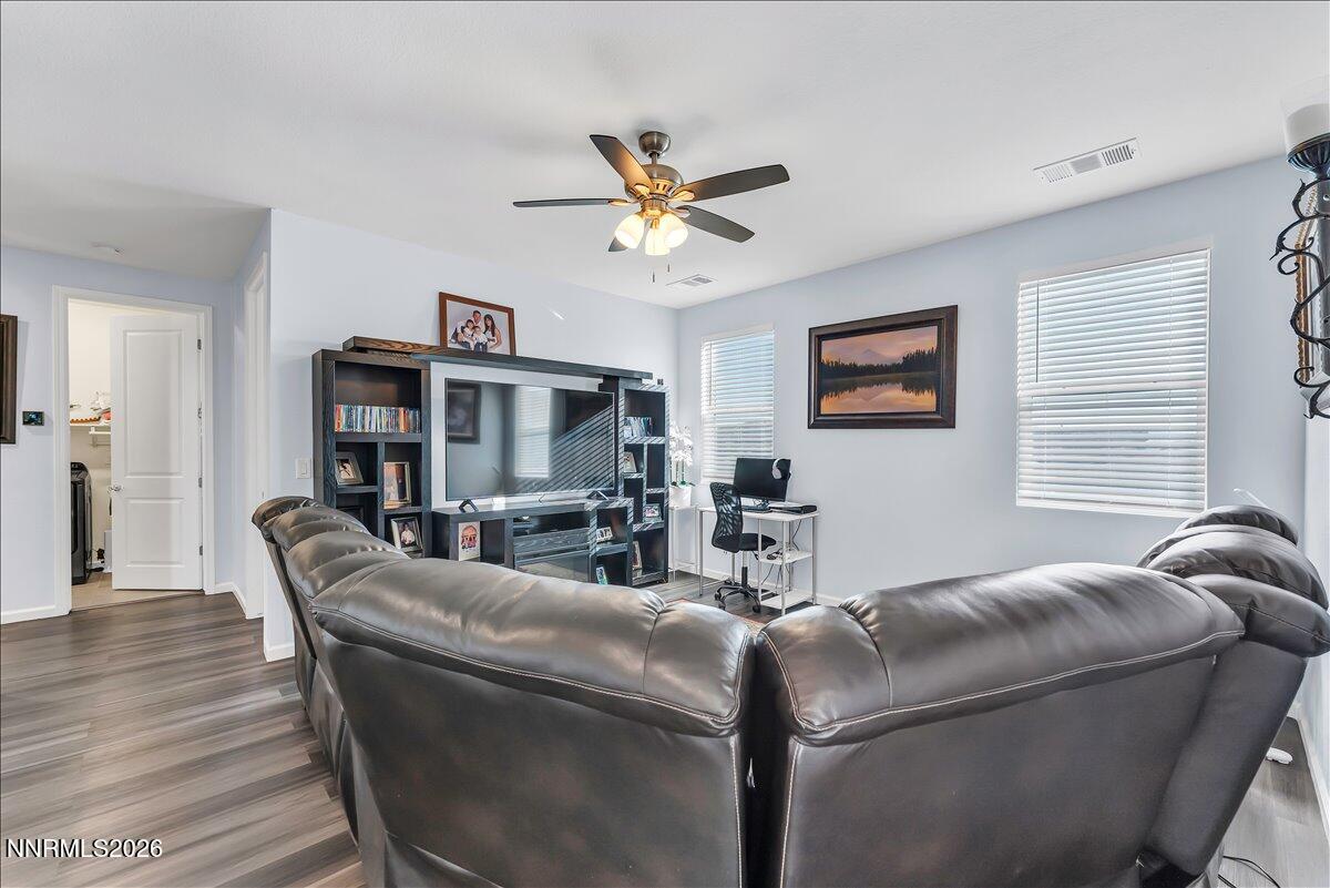 2139 Roaring Fork Court Sparks, NV 89436 - Photo 15 of 42 a living room with furniture and a ceiling fan