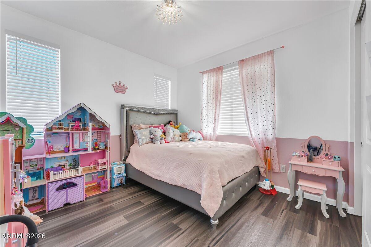 2139 Roaring Fork Court Sparks, NV 89436 - Photo 17 of 42 a bedroom with a bed and a dresser