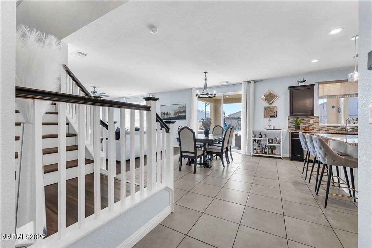 2139 Roaring Fork Court Sparks, NV 89436 - Photo 3 of 42 a dining room with furniture and a view of kitchen