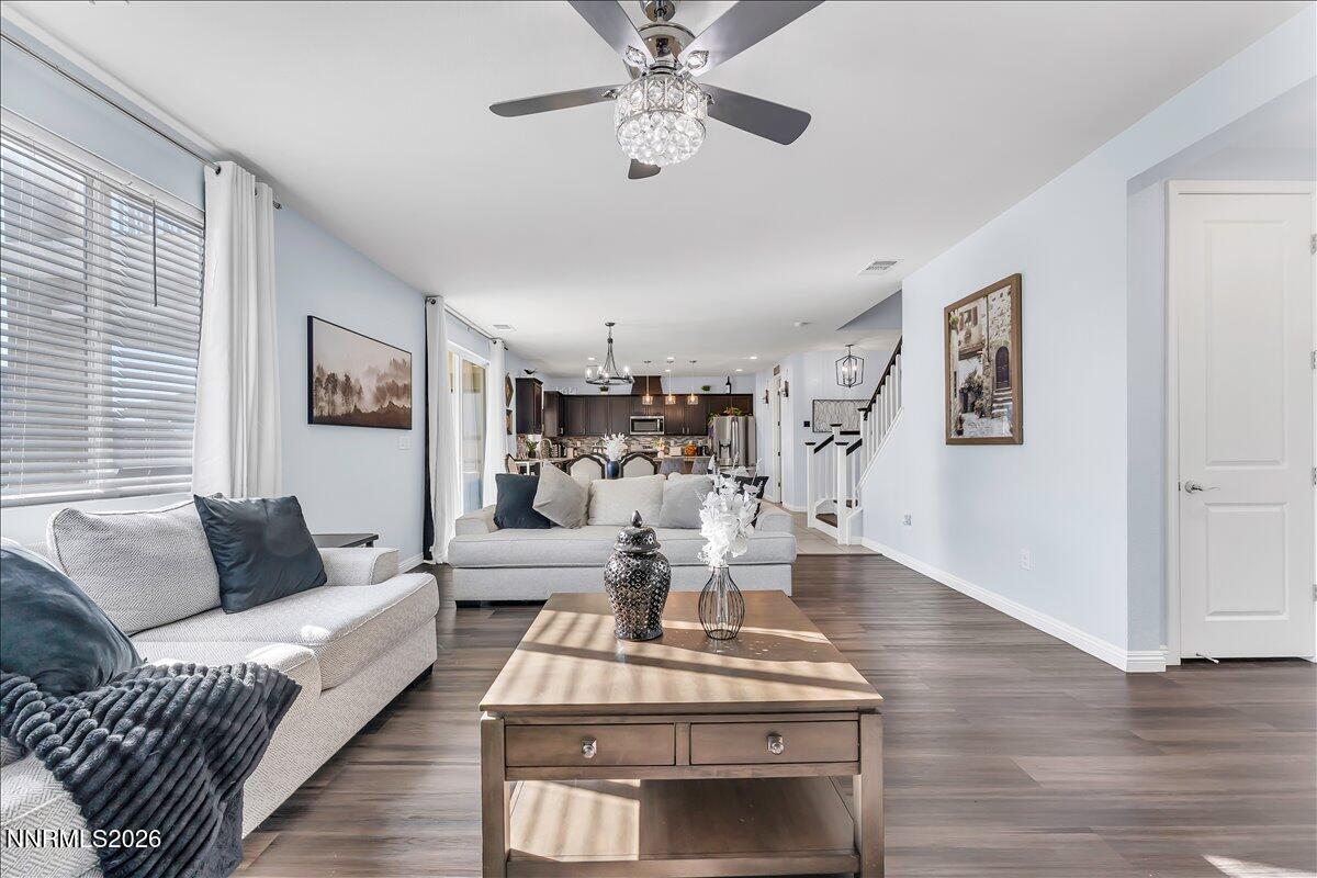 2139 Roaring Fork Court Sparks, NV 89436 - Photo 5 of 42 a living room with furniture or couch and a chandelier