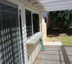 1451 Brook Road San Marcos, CA 92069 - Photo 15 of 24 View of patio and pass through window to the kitchen--great for outdoor entertaining!