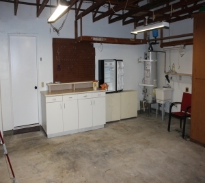 1451 Brook Road San Marcos, CA 92069 - Photo 18 of 24 Double attached garage with built in cabinets and laundry sink--lots storage and door to side yard.