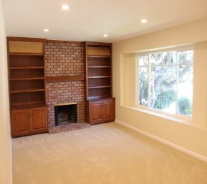 1451 Brook Road San Marcos, CA 92069 - Photo 4 of 24 Large living room with lots of windows, window seat and brick fireplace with built-in bookcases.