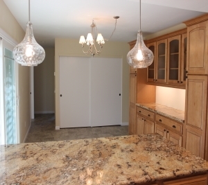 1451 Brook Road San Marcos, CA 92069 - Photo 8 of 24 View from kitchen to dining room. Granite surfaced breakfast bar in foreground and custom cabinets in dining room to the right in photo.