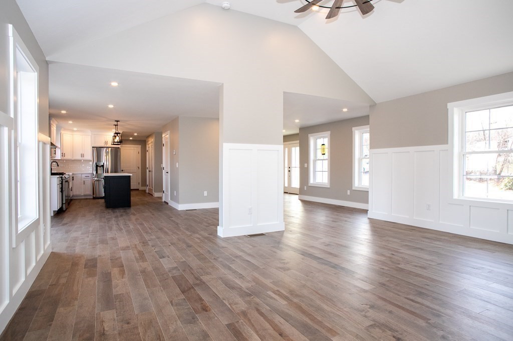 38 D Edson Road Oakham, MA 01068 - Photo 16 of 36 a view of a living room a kitchen and a wooden floor