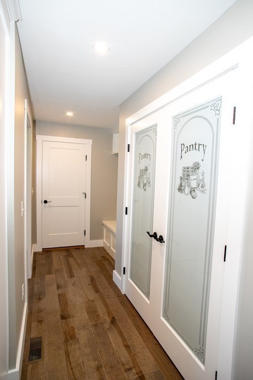 38 D Edson Road Oakham, MA 01068 - Photo 22 of 36 a view of a hallway with wooden floor and a bathroom