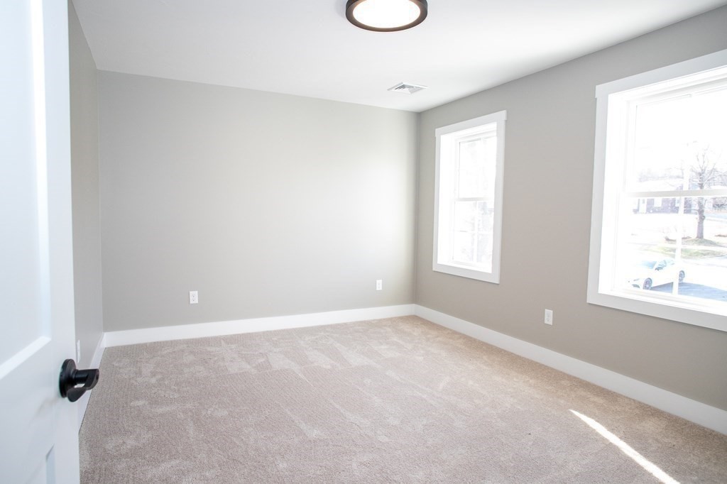 38 D Edson Road Oakham, MA 01068 - Photo 32 of 36 an empty room with windows