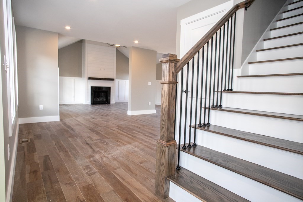 38 D Edson Road Oakham, MA 01068 - Photo 8 of 36 a view of a hallway with wooden floor and staircase