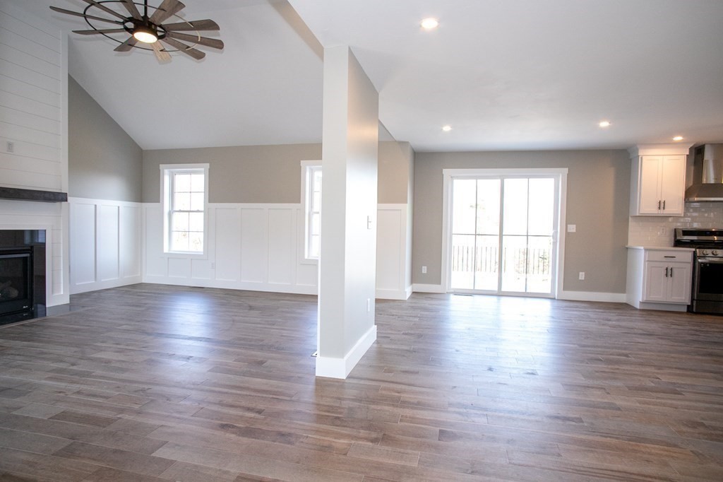 38 D Edson Road Oakham, MA 01068 - Photo 9 of 36 an empty room with wooden floor and windows