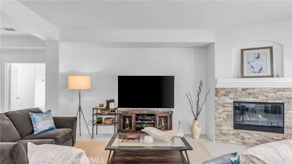 1171 Palmas Ridge Palm Springs, CA 92262 - Photo 12 of 75 Lovely stacked stone fireplace and Alexa center! You can turn on music and scented candle bowl remotely!