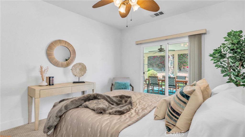 1171 Palmas Ridge Palm Springs, CA 92262 - Photo 30 of 75 Beautiful bedroom, with ceiling fan and light bright garden outside!