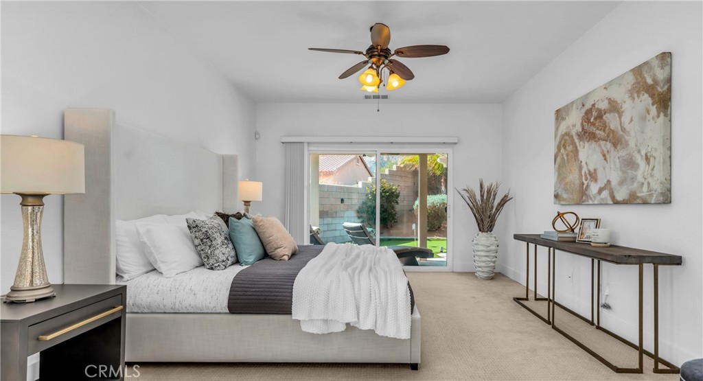 1171 Palmas Ridge Palm Springs, CA 92262 - Photo 6 of 75 Huge Primary Bedroom Suite with Sitting area and view of Private Golf putting Green in backyard!