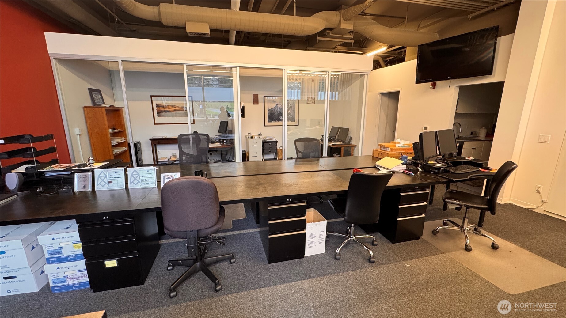 2901 Northeast Blakeley Street, Unit 3A Seattle, WA 98105 - Photo 4 of 8 a view of a workspace with furniture