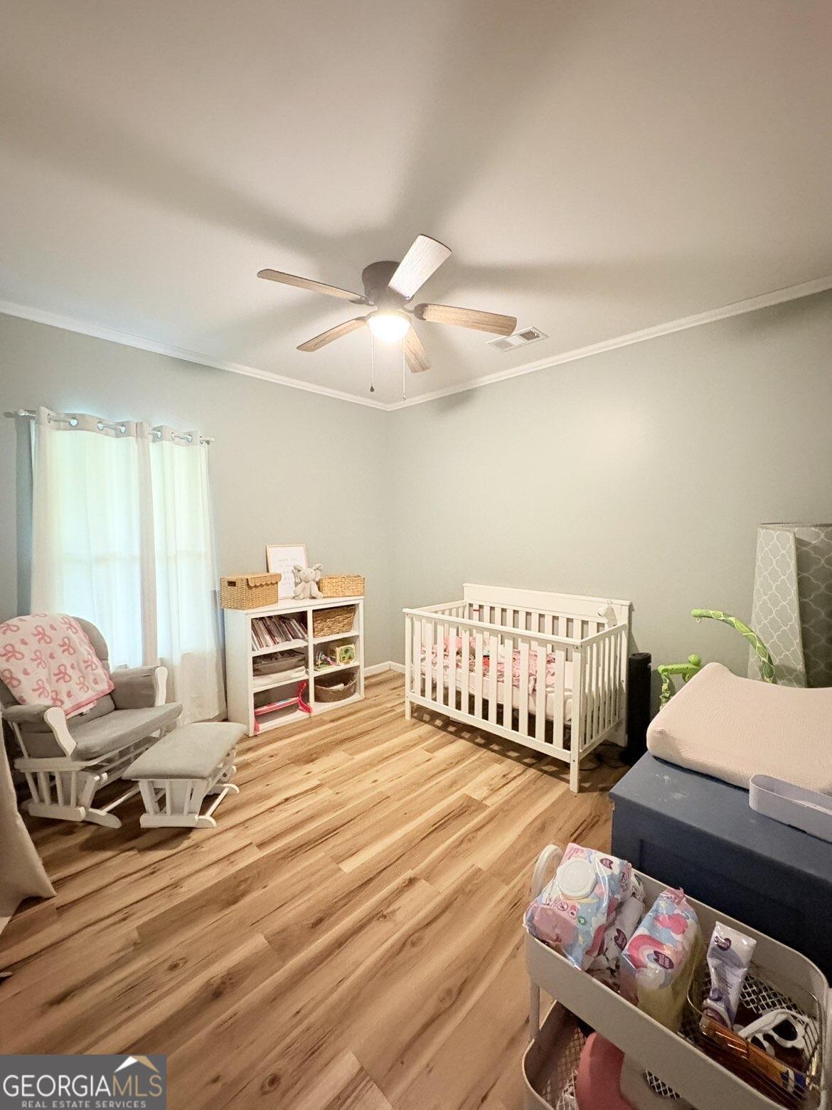 210 St Galilee Road Swainsboro, GA 30401 - Photo 15 of 18 a bedroom with furniture and wooden floor