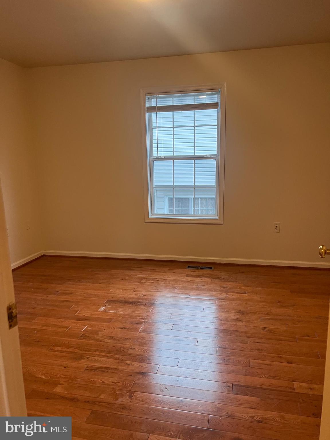 121 North Marshall Street Ranson, WV 25438 - Photo 11 of 17 an empty room with wooden floor and windows