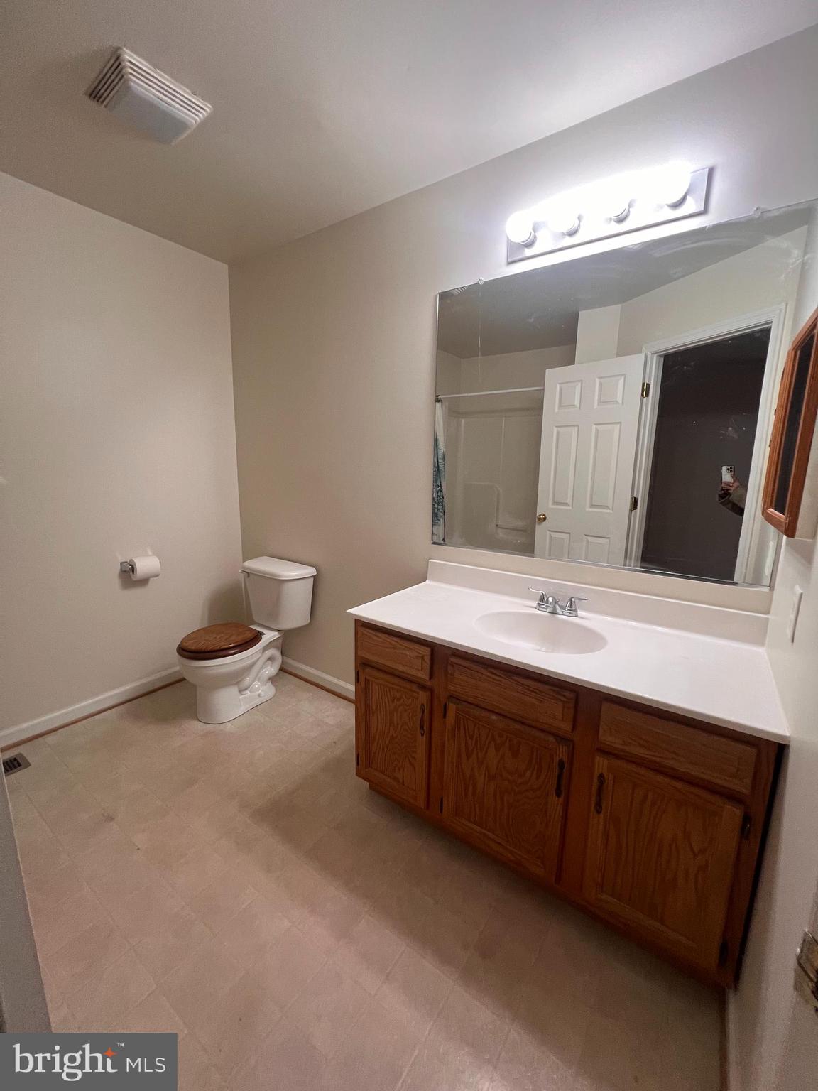 121 North Marshall Street Ranson, WV 25438 - Photo 17 of 17 a bathroom with a double vanity sink mirror and toilet