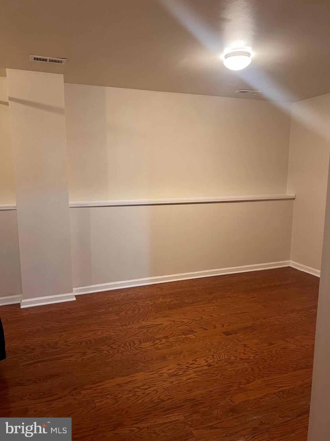 121 North Marshall Street Ranson, WV 25438 - Photo 5 of 17 an empty room with wooden floor