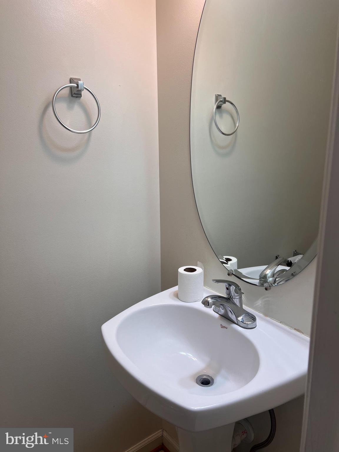 121 North Marshall Street Ranson, WV 25438 - Photo 7 of 17 a bathroom with a sink and mirror