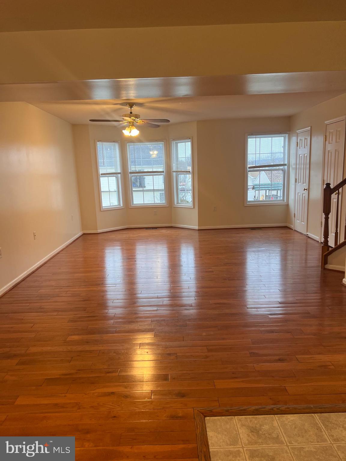 121 North Marshall Street Ranson, WV 25438 - Photo 10 of 17 a view of an empty room with window and wooden floor