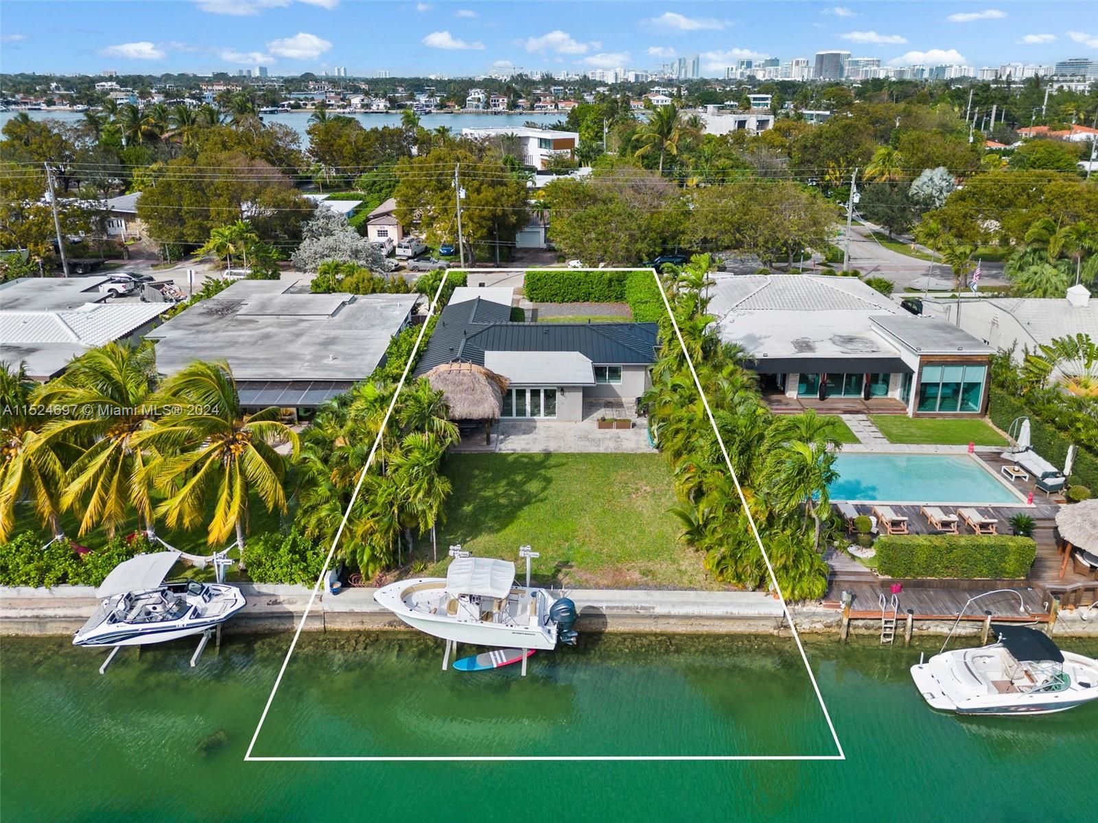 1310 Cleveland Road Miami Beach, FL 33141 - Photo 1 of 33 a view of a swimming pool with lawn chairs