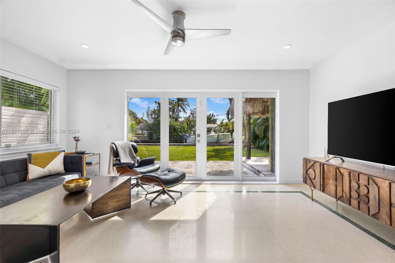 1310 Cleveland Road Miami Beach, FL 33141 - Photo 11 of 33 a living room with furniture and a flat screen tv