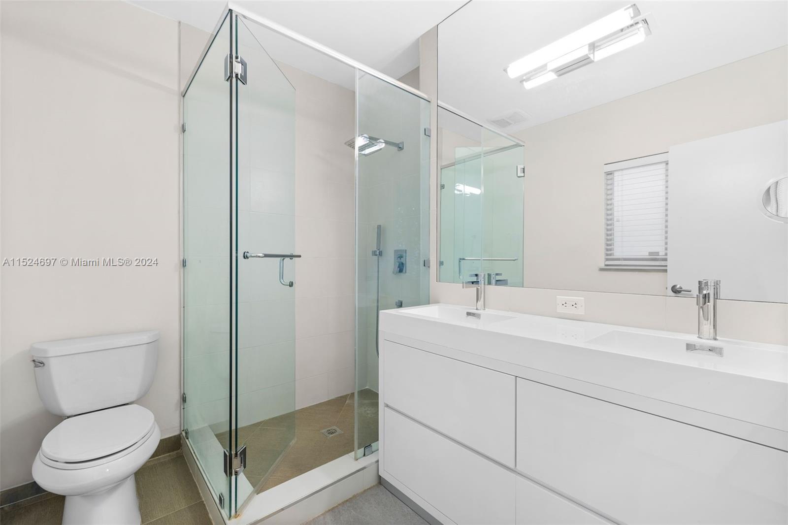 1310 Cleveland Road Miami Beach, FL 33141 - Photo 13 of 33 a bathroom with a sink toilet and shower