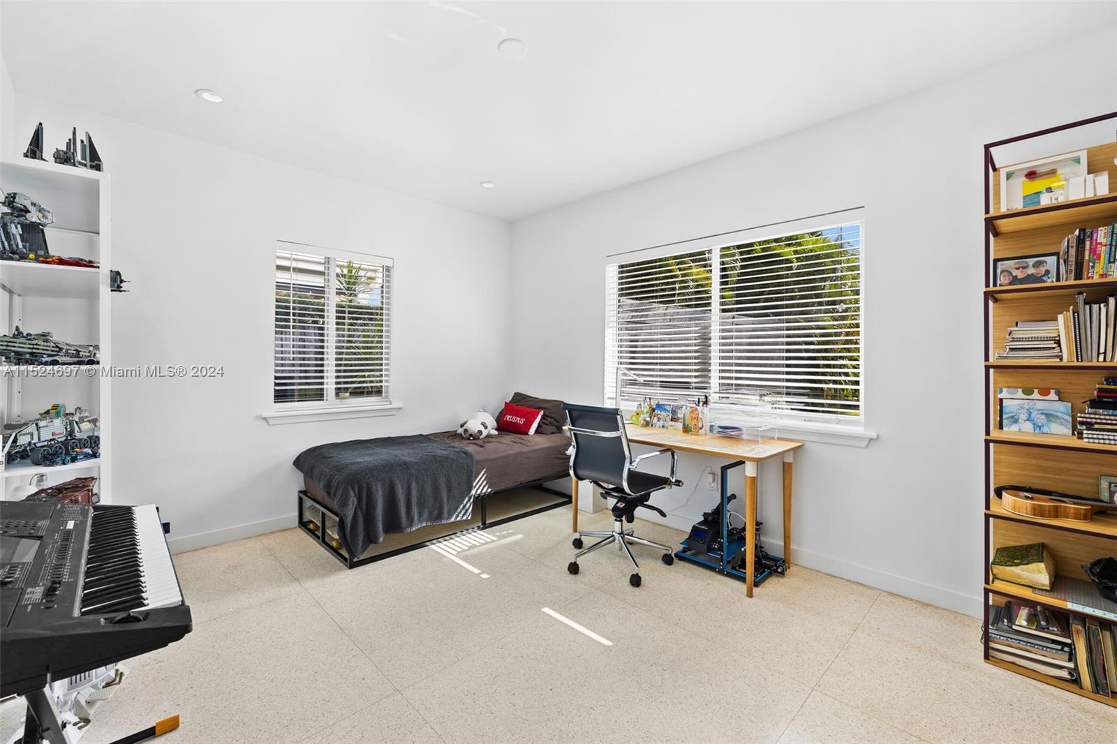1310 Cleveland Road Miami Beach, FL 33141 - Photo 14 of 33 a bedroom with furniture and a large window