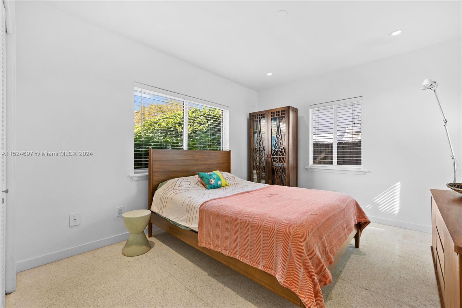 1310 Cleveland Road Miami Beach, FL 33141 - Photo 15 of 33 a bedroom with a bed and window
