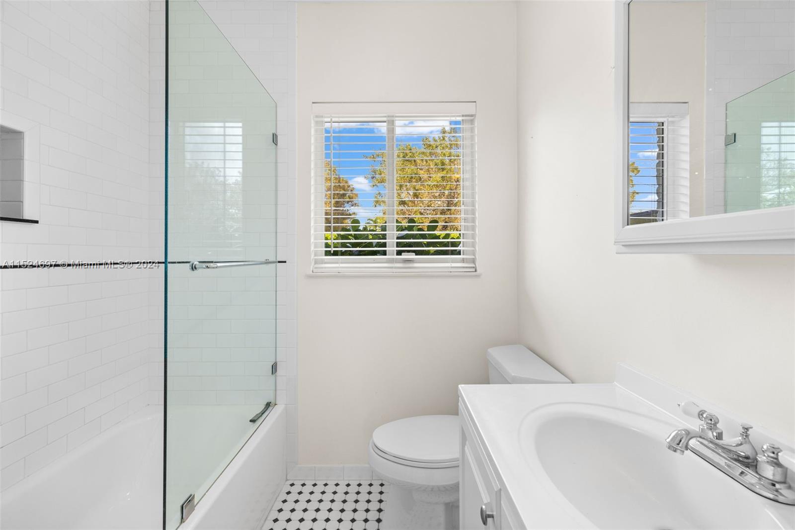 1310 Cleveland Road Miami Beach, FL 33141 - Photo 16 of 33 a bathroom with a sink toilet and shower