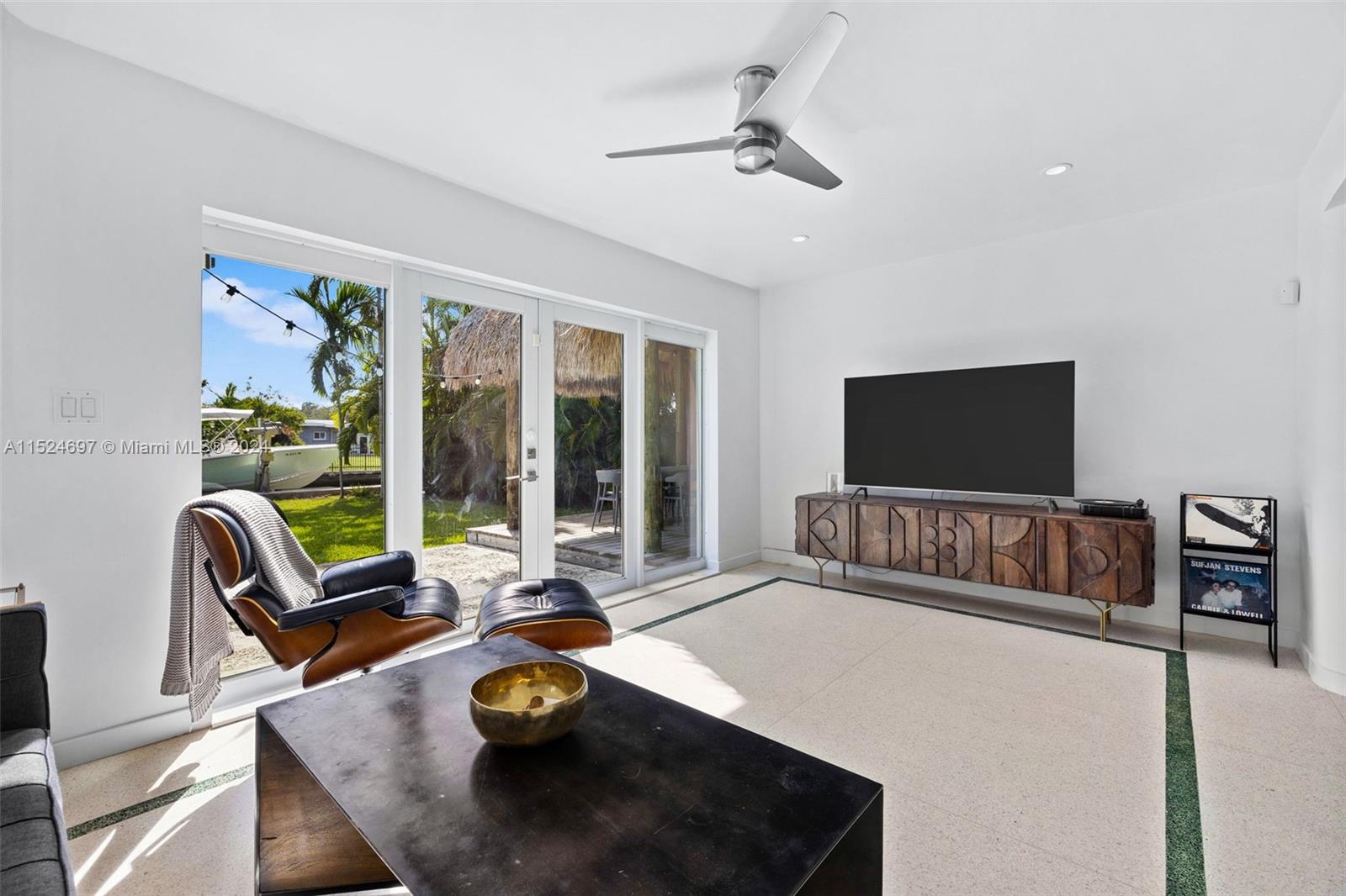 1310 Cleveland Road Miami Beach, FL 33141 - Photo 18 of 33 a living room with furniture and a flat screen tv