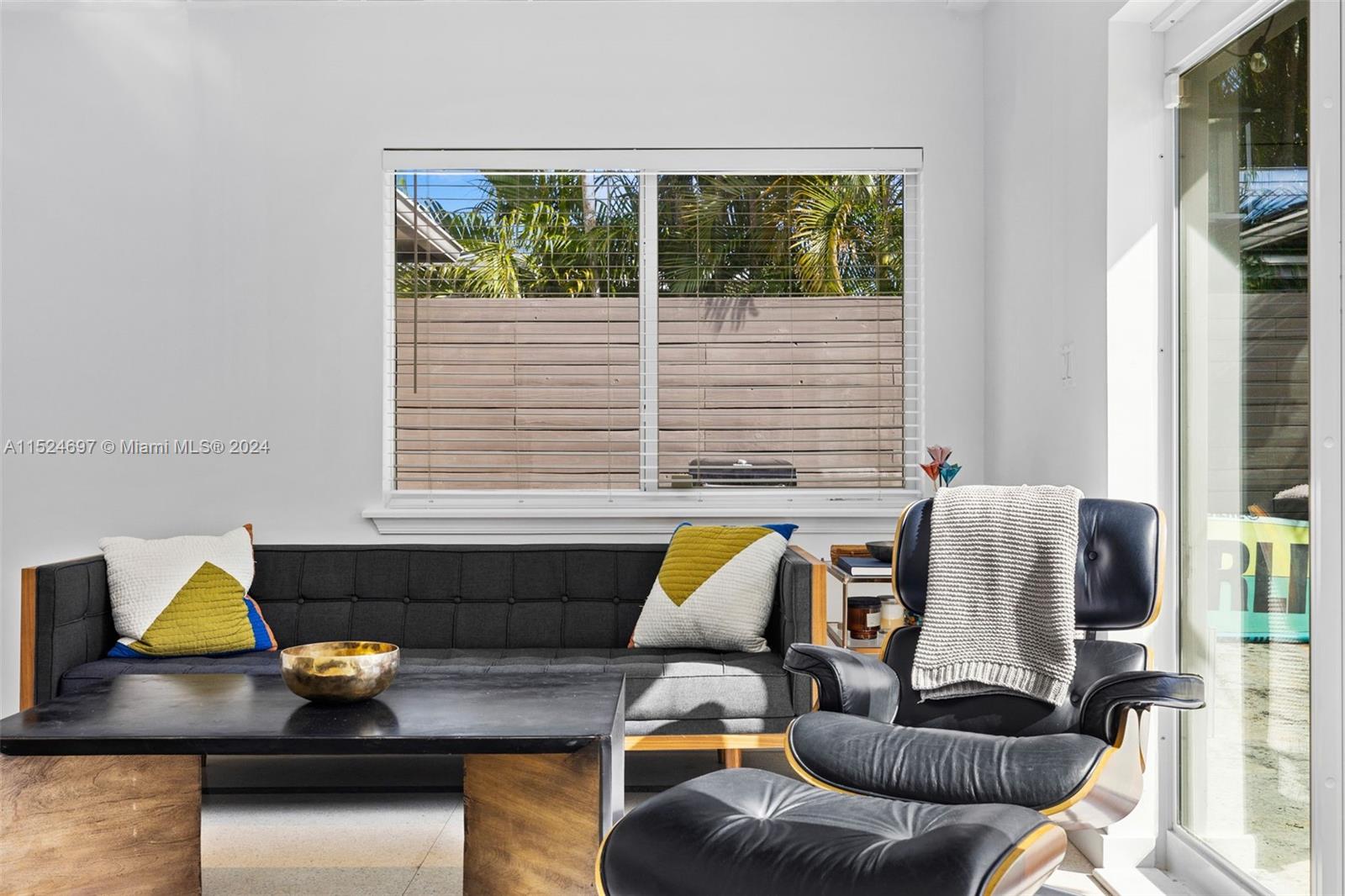 1310 Cleveland Road Miami Beach, FL 33141 - Photo 19 of 33 a living room with furniture and a window