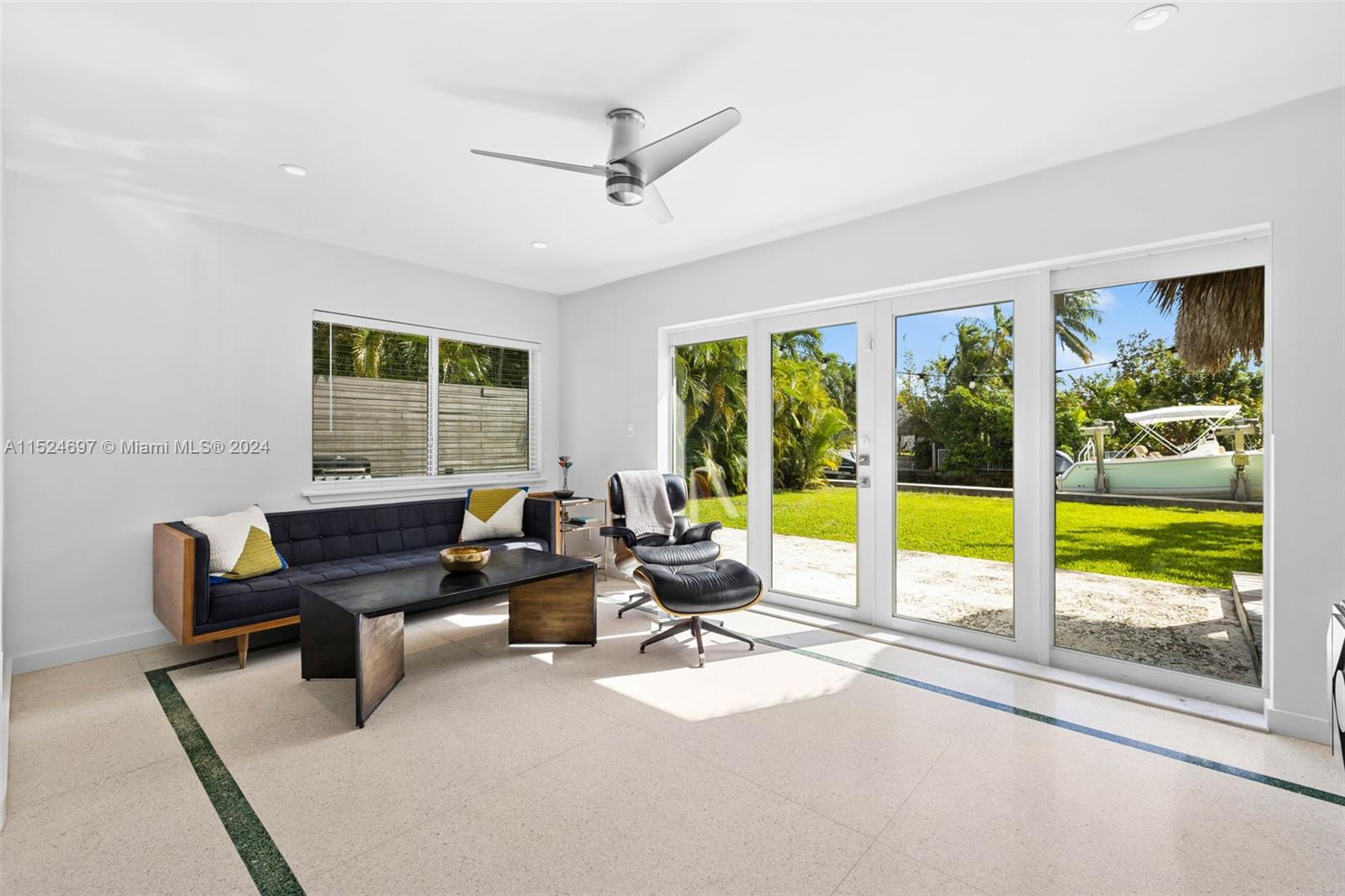1310 Cleveland Road Miami Beach, FL 33141 - Photo 20 of 33 a living room with furniture and floor to ceiling windows