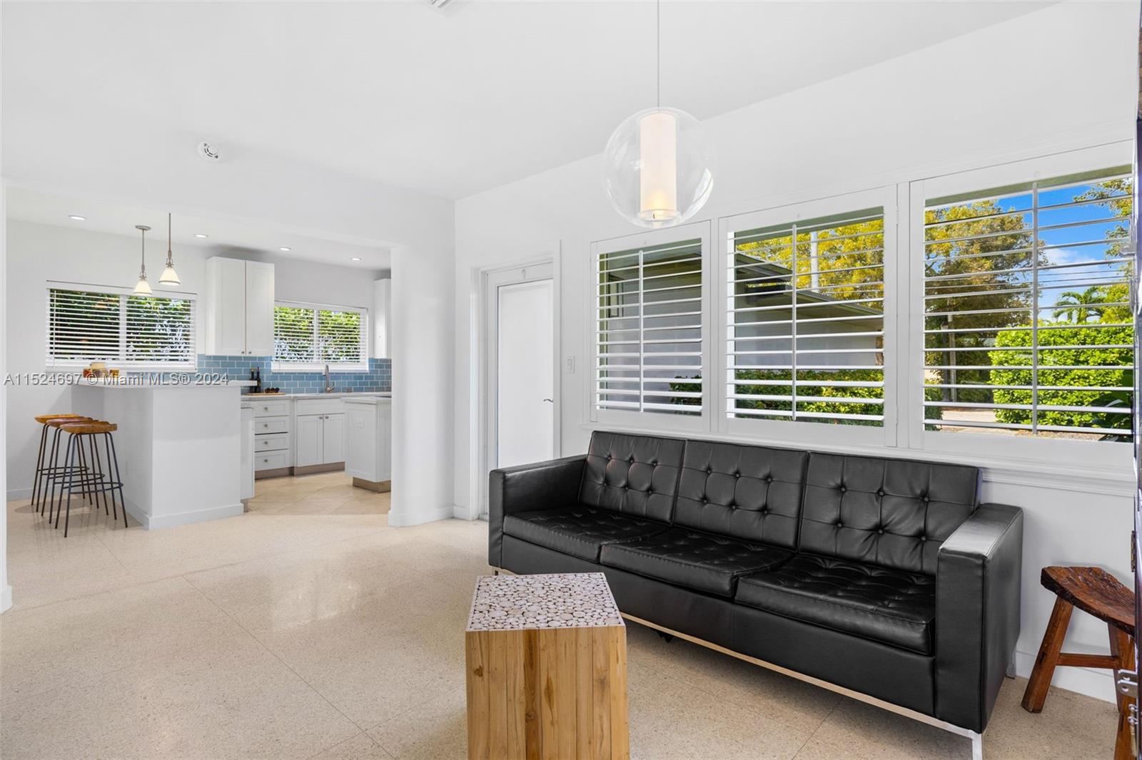 1310 Cleveland Road Miami Beach, FL 33141 - Photo 5 of 33 a living room with furniture and a large window