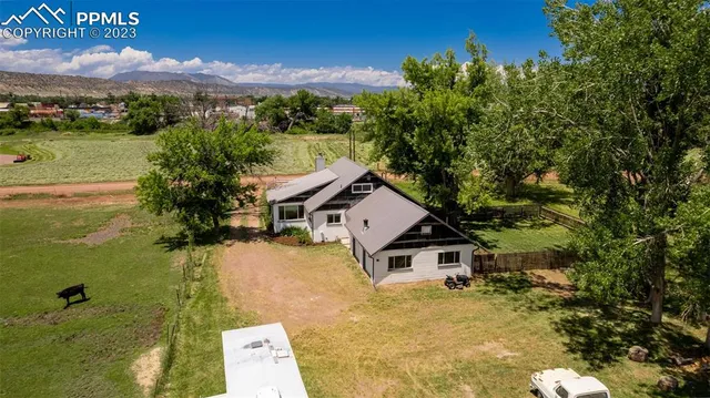 a aerial view of a house with a yard